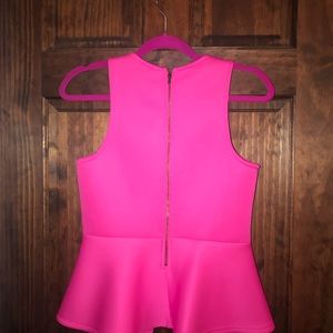 Scans peplum top. Very forgiving!